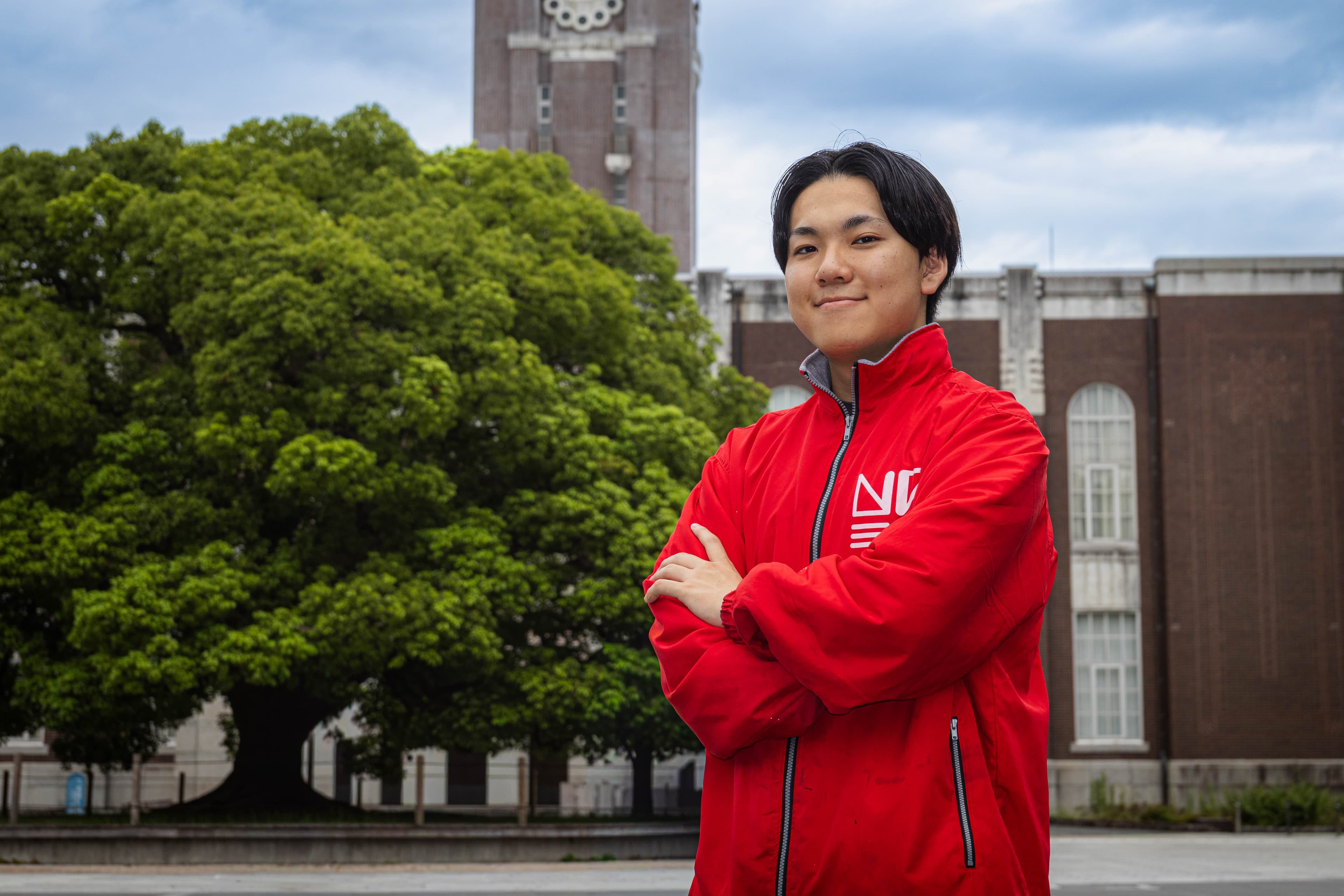 The Secretary-General standing in front of the clock tower